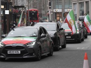 Supporting image for story: Demonstrators gather outside Iranian embassy in support of war