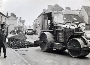 Dawley High Street in April 1967. The caption reads: ‘The road roller and workmen moved in
to begin their task of resurfacing the road. The closure of the road caused a storm of protest
from Dawley Urban District Council’s highways and public works committee.’