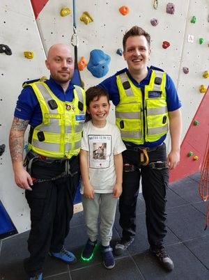 With PCSOs Gareth Ryder and Patrick Ladley, who supported Nate on his climb