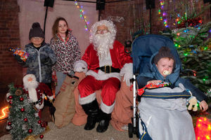 Siblings Ethan, six, Amber, nine and Leo Davies, two, all went in to see Santa and gave him their present wish lists. Image by Andy Compton