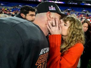 Supporting image for story: Are you ready for it? Taylor Swift kisses Travis Kelce as he heads to Super Bowl