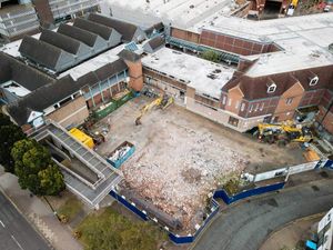 Supporting image for story: Drone shots give fresh perspective on Shrewsbury riverside demolition work after old doctor's surgery is knocked down