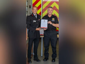 Supporting image for story: 'I'd do it again in a heartbeat' - Firefighter who saved fan's life at football match speaks at award ceremony