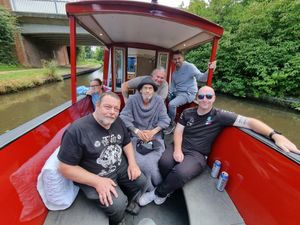 Lee Moody (centre) on the canal trip with his family and friends.