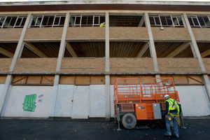 Workmen at the site of the former Charles Clarke building in Chapel Ash.