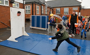 Year six teacher Chris Hearsey braves the stocks to raise money for St Giles Hospice