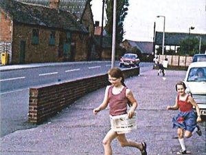 Supporting image for story: Picture from the past: Do you recognise these youngsters running with their copy of the Express & Star?