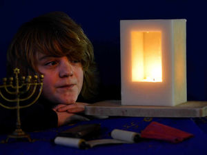 Supporting image for story: Shropshire schoolboy lights a candle to remember the Holocaust