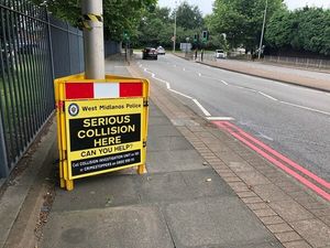 A police sign at the scene of the collision in Trinity Way, in West Bromwich