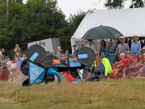 Supporting image for story: Going, going, gone! 20 pictures of karts flipping, crashing and hurtling down the track at Ludlow soap box race as crowds delight in thrills and spills