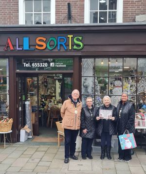Mayor Roy Aldcroft (left) presenting All Sorts with second prize.