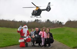 Santa with Georgie and Stefan, 2, Gergana, 4 and Steliyana Baychev, from Shrewsbury
