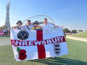 Supporting image for story: Salopian England fan flying the Shrewsbury flag in Qatar at his first World Cup