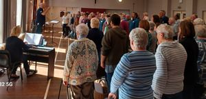 Eighty plus singers ac companied by Heather Howell.