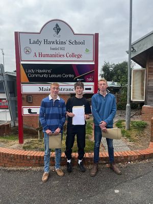 Oliver Davies, Toby Harrison and Spencer Davies with their results at Lady Hawkins School, Kington