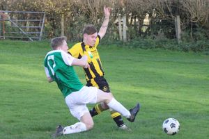 Penybont's Logan Evans pounces to turn the loose ball home