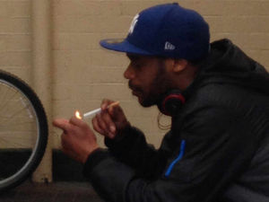 Supporting image for story: 'Smoking man' picture released in Wolverhampton robbery appeal