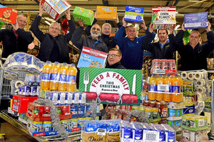 Goodyear workers with some of the food that has been donated to the Feed A Family campaign