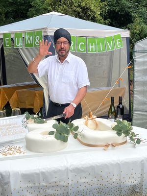 Warinder Juss, MP Wolverhampton West, cuts the 80th Anniversary cake