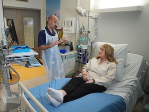 Senior clinical practice facilitator Rob McDonnell talks to patient Katie Tinkler