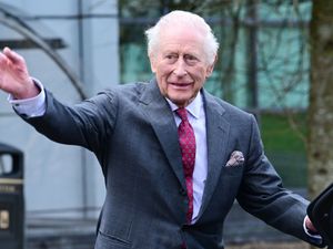 King Charles waves goodbye to well-wishers following a visit to the Cancer Research Centre at Ulster University, on day two of the royal visit to Northern Ireland