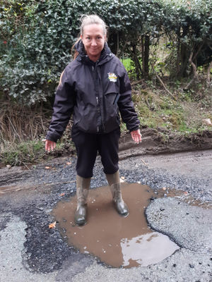 Hayley Turner shows one of the potholes in Cleeton St Mary. Picture: LDRS