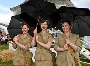LAST COPYRIGHT NATIONAL WORLD TIM THURSFIELD -08/06/25RAF Cosford Air Show.The Bluebird Belles don't let the rain dampen their spirits.