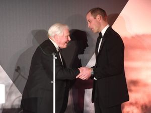 The Prince of Wales and Sir David Attenborough shaking hands