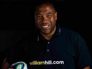 Supporting image for story: Amateur football club charged after John Barnes visit marred by racist abuse