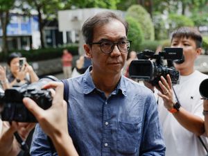 Supporting image for story: Hong Kong court sentences former editor to 21 months in jail
