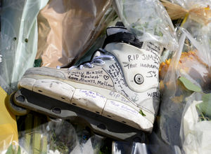 Tributes written on a roller skate at the scene 