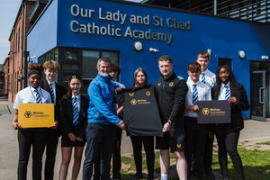 Members of the Wolves Foundation celebrate the launch with students. Photo: Joe Williams