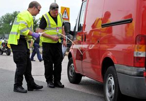 Police and partner agencies stop and check vehicles at Prees Heath during a clampdown on criminals on the roads