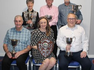 Champions of Mid Shropshire Bowling League Divisions One to six face the camera, including Newport’s Mick Jones (front left)