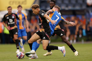 Shrewsbury Town's Carl Winchester and Leicester City's Kasey McAteer 