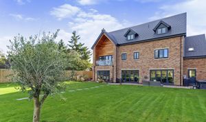 Behind the house is a large patio and garden. Picture: Purplebricks