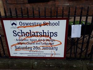 A red liquid was sprayed on the school's sign