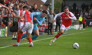 Walsall wing-back Connor Barrett tussles with Ryan Graydon.