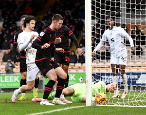 The ball goes over the line put Saddlers in the lead.