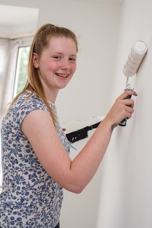 Dayna helps decorate the YMCA rooms as part of her NCS social action project