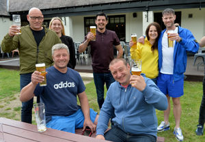 Regulars at The Wild Pig pub in Shrewsbury raise a glass