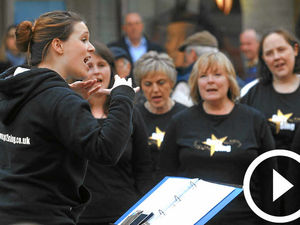 Supporting image for story: Choir takes to streets for fund