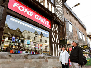 Supporting image for story: Phone shop makes giant sign mistake