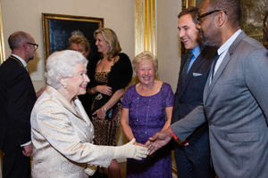 Queen Elizabeth II meets Lenny Henry (right) as Kathleen Williams (second right) and David Walliams look on during a reception and awards ceremony at the Royal Academy of Arts, Burlington House, London