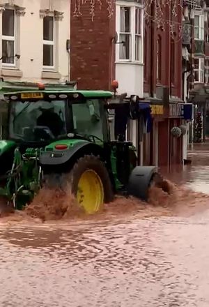 A man in a tractor driving down Tenbury Wells
