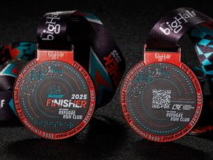 Supporting image for story: Tower Bridge and Cutty Sark on Big Half finisher medal designed with refugees