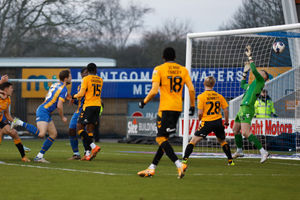 Matthew Pennington of Shrewsbury Town scores a goal to make it 0-3 (AMA)