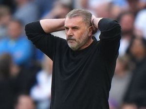 Tottenham boss Ange Postecoglou holds his head in his hands