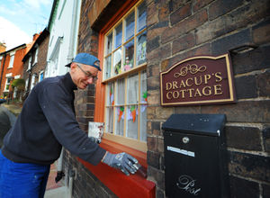 Dennis Dracup, spending time painting some of his father's, artist Antony Dracup, old house, at Dracup Cottage