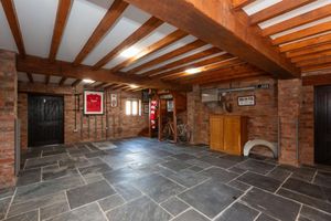 The garage at Stoke Park that has stairs leading to a cinema room. Picture: Rightmove/Savills.